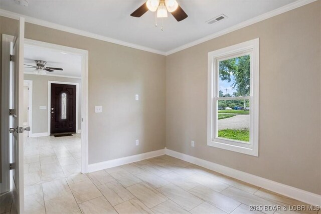 608 8th St, Eldon, MO 65026 - spare room with a ceiling fan, crown molding, and baseboards