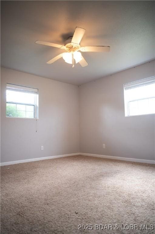 18 Chippewa Dr, Eldon, MO 65026 - empty room featuring healthy amount of natural light, carpet, ceiling fan, and baseboards