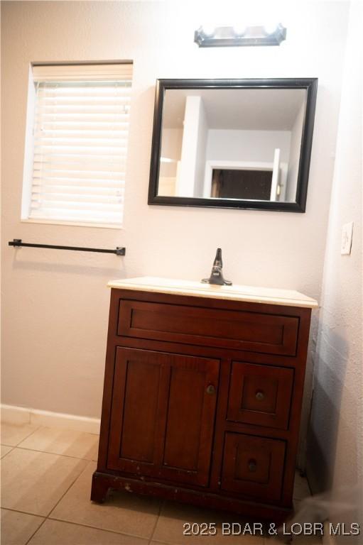 18 Chippewa Dr, Eldon, MO 65026 - bathroom featuring vanity, tile patterned floors, and baseboards
