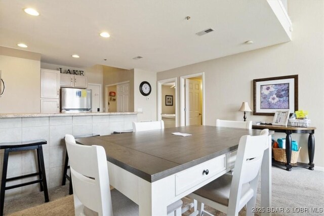 1481 Ledges Dr Unit 1047, Osage Beach, MO 65065 - dining space with light colored carpet and recessed lighting