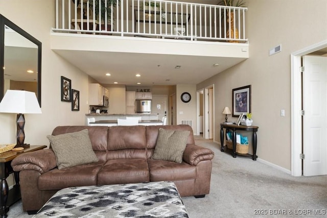 1481 Ledges Dr Unit 1047, Osage Beach, MO 65065 - living area with a high ceiling and light carpet