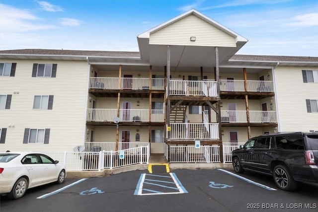 1481 Ledges Dr Unit 1047, Osage Beach, MO 65065 - view of apartment building / complex featuring uncovered parking