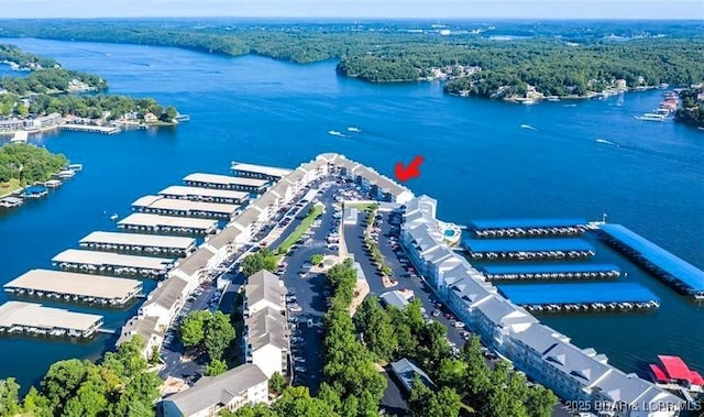 1481 Ledges Dr Unit 1047, Osage Beach, MO 65065 - drone / aerial view of a large body of water and a heavily wooded area