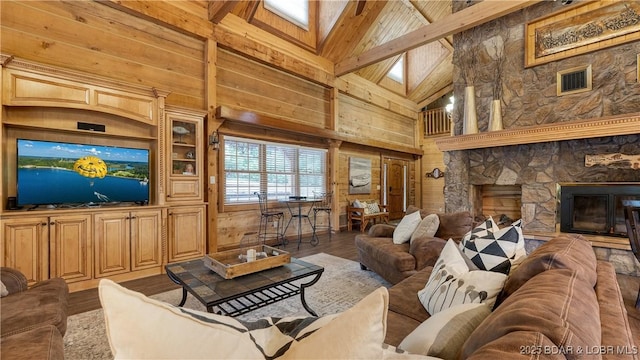1624 Kays Point Rd, Four Seasons, MO 65049 - living room featuring wooden walls, high vaulted ceiling, beam ceiling, wood finished floors, and a skylight