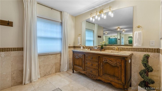 1624 Kays Point Rd, Four Seasons, MO 65049 - bathroom with tile walls, a wainscoted wall, double vanity, and tile patterned flooring