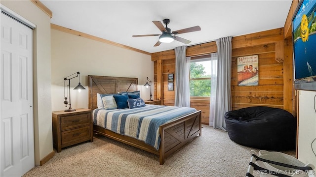 1624 Kays Point Rd, Four Seasons, MO 65049 - bedroom with light colored carpet, wood walls, crown molding, and a ceiling fan