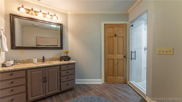 1624 Kays Point Rd, Four Seasons, MO 65049 - full bathroom featuring wood finished floors, vanity, a shower stall, baseboards, and ornamental molding