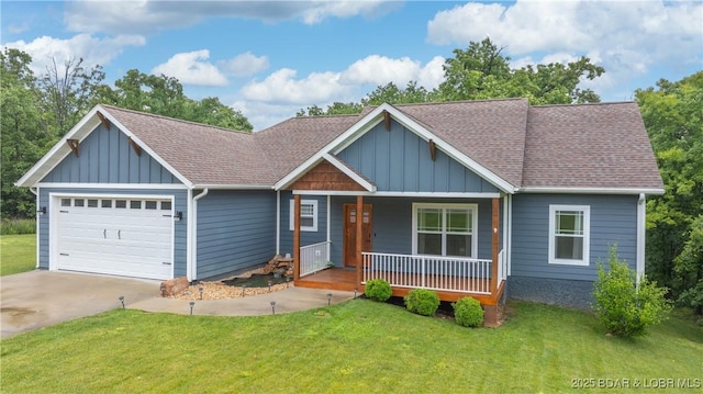 184 Porch Swing Blvd, Camdenton, MO 65020 - view of front of home with a garage, a porch, board and batten siding, concrete driveway, and a front yard