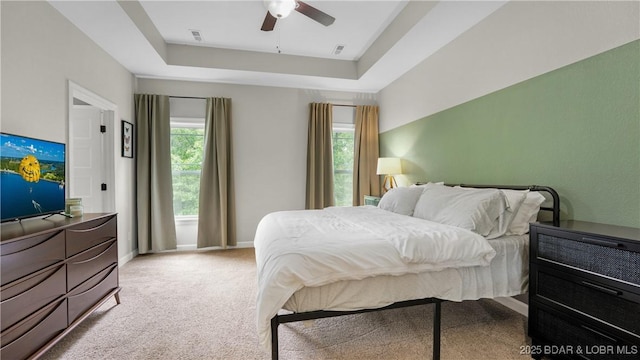 184 Porch Swing Blvd, Camdenton, MO 65020 - bedroom featuring a tray ceiling, carpet, baseboards, and ceiling fan