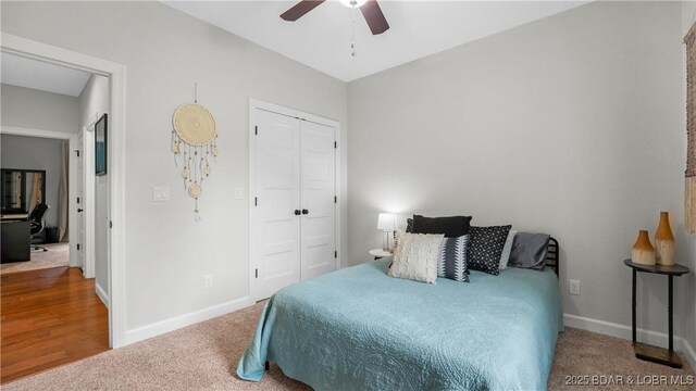 184 Porch Swing Blvd, Camdenton, MO 65020 - carpeted bedroom featuring baseboards, a closet, and ceiling fan