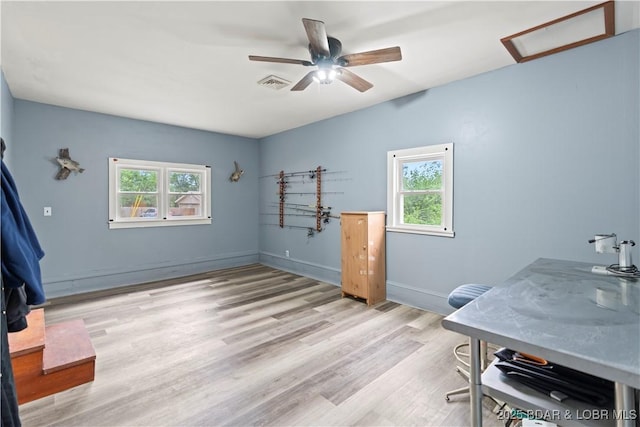 320 N Chestnut St, Eldon, MO 65026 - home office with wood finished floors, a ceiling fan, attic access, and baseboards