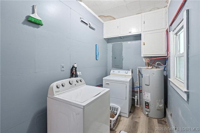 320 N Chestnut St, Eldon, MO 65026 - washroom with cabinet space, electric water heater, independent washer and dryer, electric panel, and wood finished floors