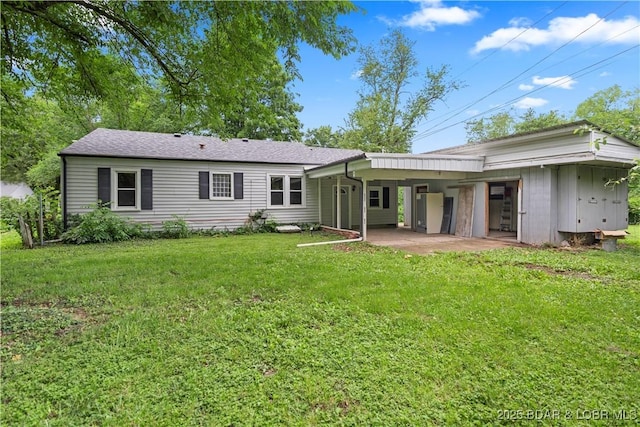 320 N Chestnut St, Eldon, MO 65026 - rear view of house with a patio area and a yard