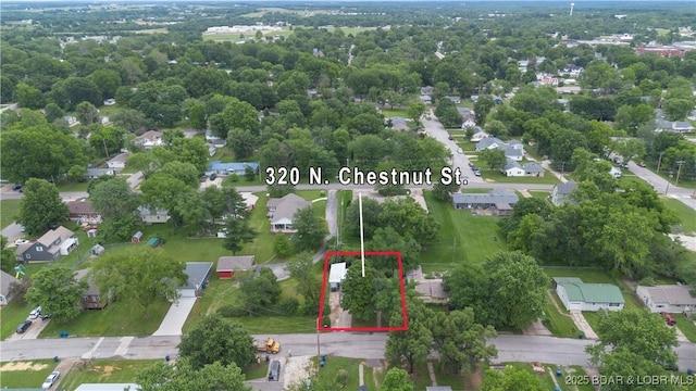 320 N Chestnut St, Eldon, MO 65026 - aerial view of residential area with property boundaries highlighted
