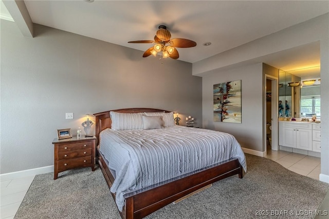 757 Malibu Rd Unit A102, Osage Beach, MO 65065 - bedroom featuring baseboards, ceiling fan, light tile patterned floors, and ensuite bathroom