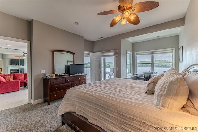 757 Malibu Rd Unit A102, Osage Beach, MO 65065 - carpeted bedroom featuring access to outside, ceiling fan, and baseboards