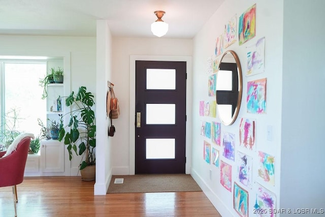 248 Midway Rd, Eldon, MO 65026 - entryway featuring wood finished floors and baseboards