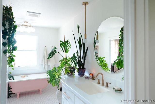 248 Midway Rd, Eldon, MO 65026 - full bath featuring vanity and a freestanding tub