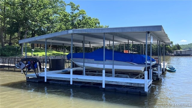 1206 Triple Cove Ln, Climax Springs, MO 65324 - dock with boat lift and a water view