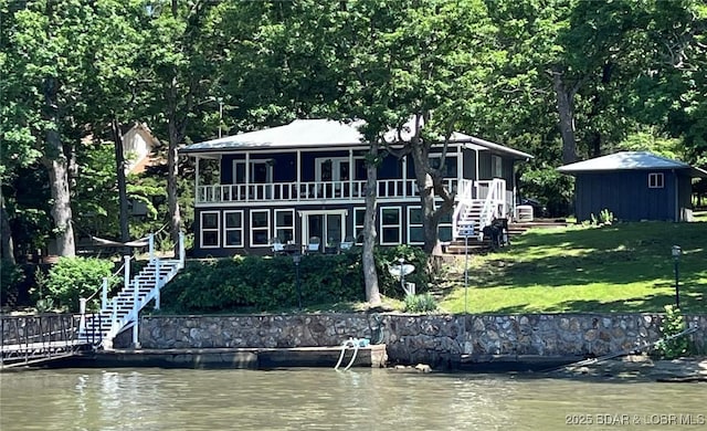 1206 Triple Cove Ln, Climax Springs, MO 65324 - back of property featuring stairway, a yard, and a water view