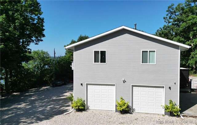 31762 Pecan Dr, Rocky Mount, MO 65072 - view of property exterior featuring a garage