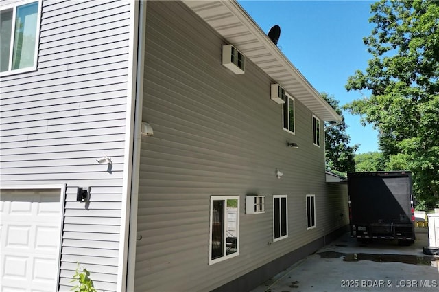 31762 Pecan Dr, Rocky Mount, MO 65072 - view of home's exterior with an attached garage