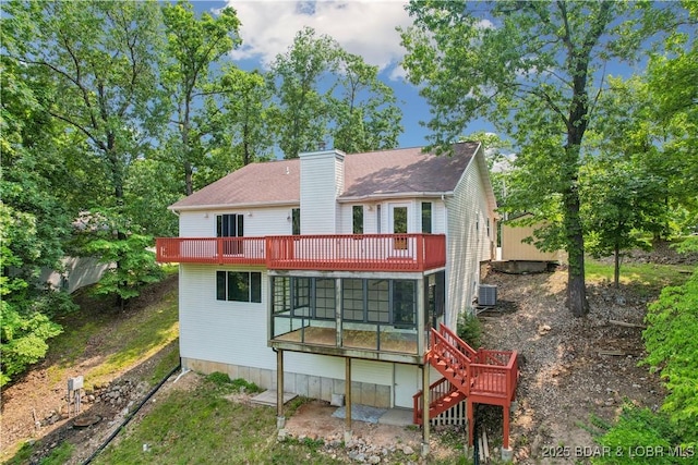 1380 Bluff Dr, Osage Beach, MO 65065 - back of house featuring a sunroom, a chimney, stairs, and central AC unit