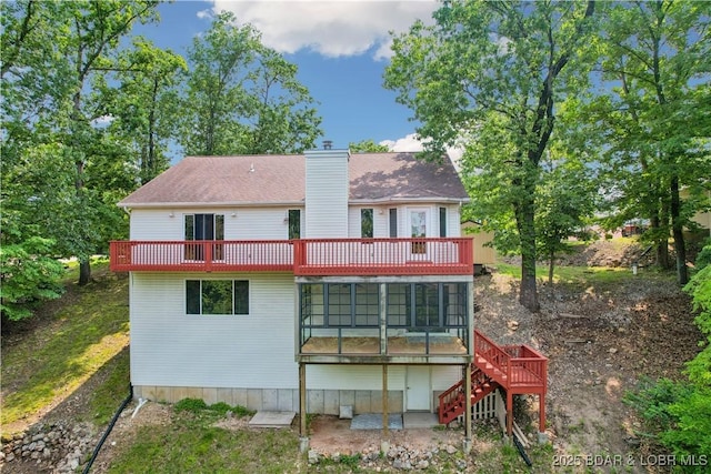 1380 Bluff Dr, Osage Beach, MO 65065 - rear view of house with a chimney, stairs, and a wooden deck
