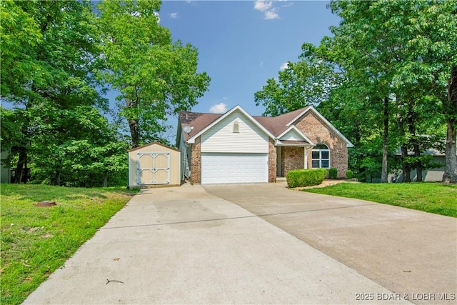 1380 Bluff Dr, Osage Beach, MO 65065 - view of front facade featuring brick siding, a front yard, concrete driveway, and a garage