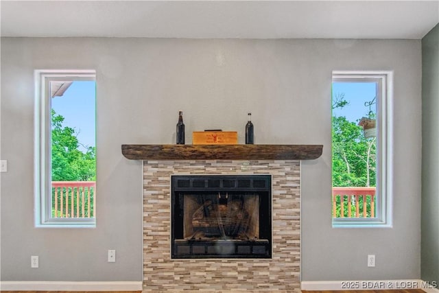 1380 Bluff Dr, Osage Beach, MO 65065 - detailed view of a tiled fireplace and baseboards