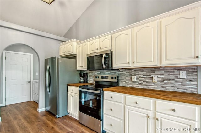 1380 Bluff Dr, Osage Beach, MO 65065 - kitchen with butcher block countertops, stainless steel appliances, washing machine and clothes dryer, tasteful backsplash, and lofted ceiling