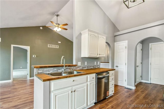 1380 Bluff Dr, Osage Beach, MO 65065 - kitchen with wooden counters, a sink, stainless steel dishwasher, high vaulted ceiling, and ceiling fan