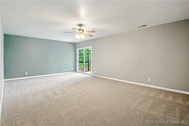 1380 Bluff Dr, Osage Beach, MO 65065 - unfurnished room featuring a ceiling fan, carpet flooring, and baseboards
