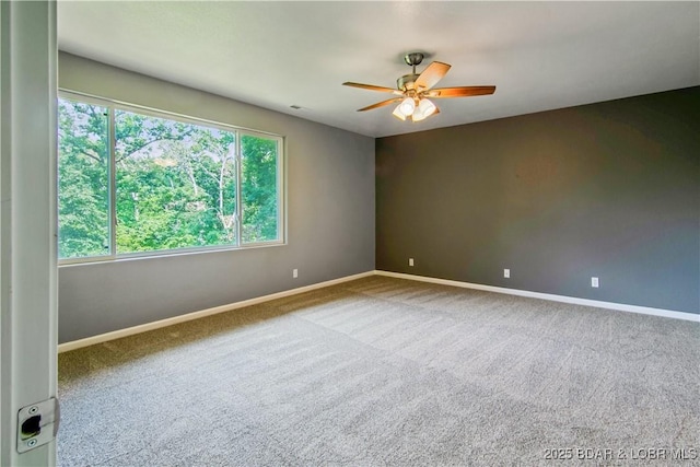 1380 Bluff Dr, Osage Beach, MO 65065 - carpeted spare room with a ceiling fan, healthy amount of natural light, and baseboards