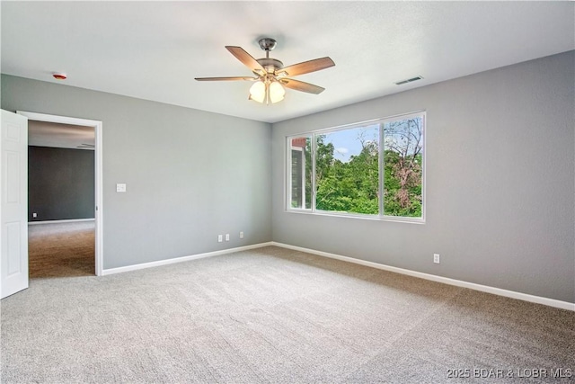 1380 Bluff Dr, Osage Beach, MO 65065 - spare room featuring carpet floors, ceiling fan, and baseboards