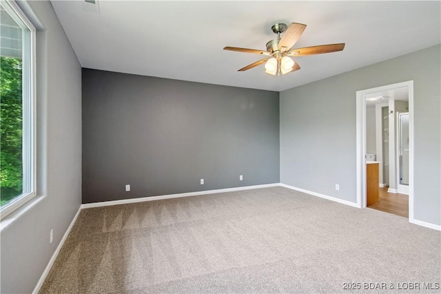 1380 Bluff Dr, Osage Beach, MO 65065 - empty room featuring carpet flooring, a ceiling fan, plenty of natural light, and baseboards
