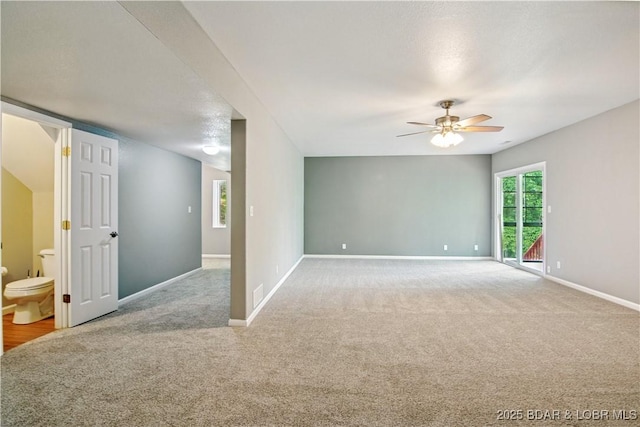 1380 Bluff Dr, Osage Beach, MO 65065 - carpeted spare room with a ceiling fan and baseboards