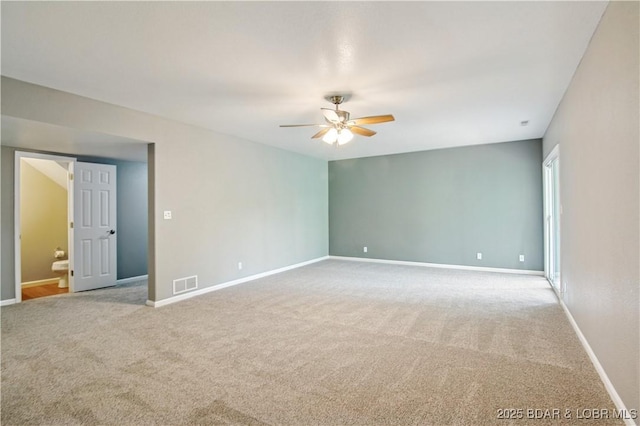 1380 Bluff Dr, Osage Beach, MO 65065 - empty room with ceiling fan, light colored carpet, and baseboards