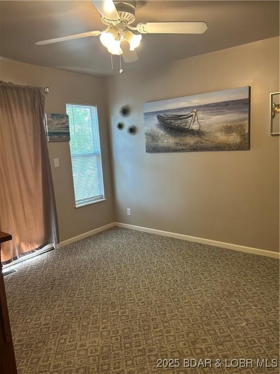 32585 N Ivy Bend Rd, Stover, MO 65078 - carpeted empty room featuring a ceiling fan and baseboards