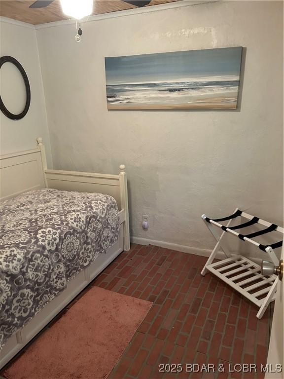 32585 N Ivy Bend Rd, Stover, MO 65078 - bedroom featuring brick floors and baseboards