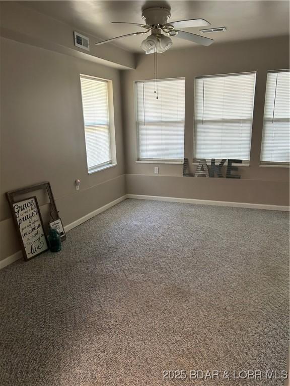 32585 N Ivy Bend Rd, Stover, MO 65078 - empty room featuring carpet floors, ceiling fan, and baseboards