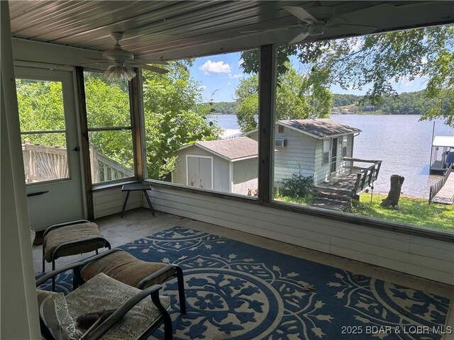 32585 N Ivy Bend Rd, Stover, MO 65078 - sunroom featuring ceiling fan and a water view