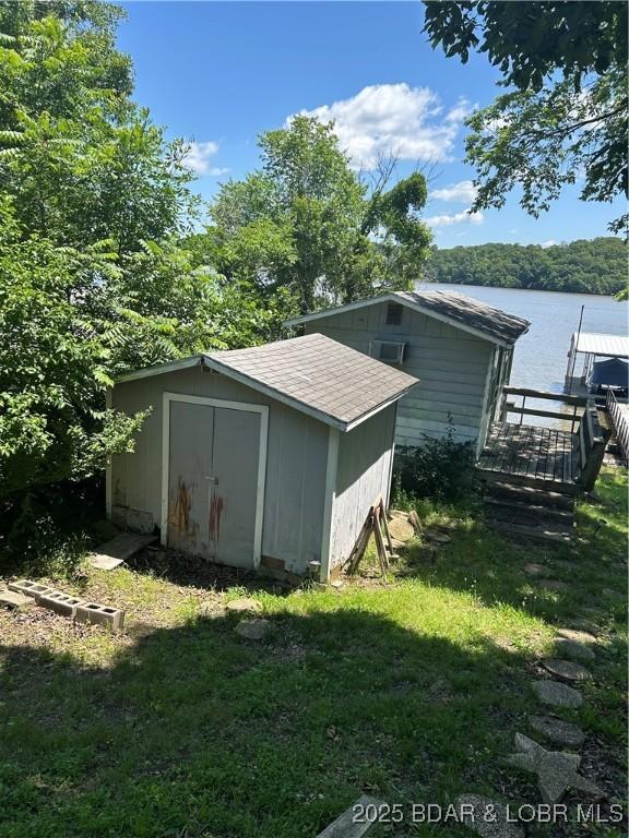 32585 N Ivy Bend Rd, Stover, MO 65078 - view of shed featuring a water view