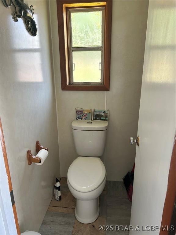 32585 N Ivy Bend Rd, Stover, MO 65078 - bathroom with toilet and tile patterned flooring