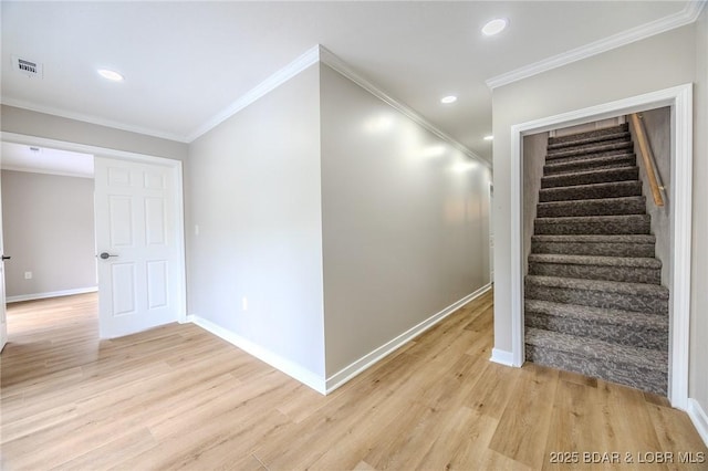 29 Vine St, Edwards, MO 65326 - stairs featuring wood finished floors, crown molding, and recessed lighting