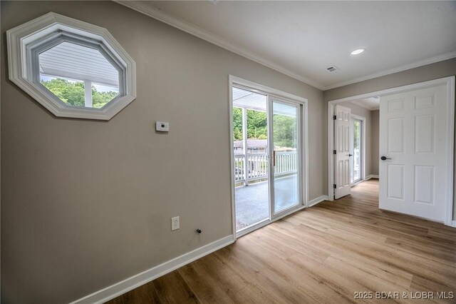 29 Vine St, Edwards, MO 65326 - spare room with wood finished floors, ornamental molding, and recessed lighting