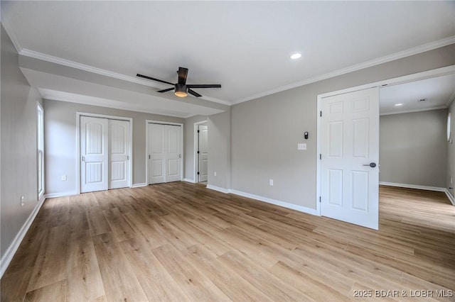 29 Vine St, Edwards, MO 65326 - unfurnished bedroom with multiple closets, wood finished floors, recessed lighting, ornamental molding, and ceiling fan