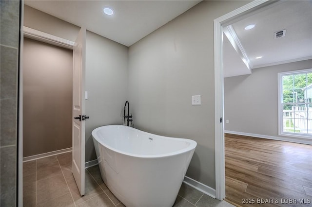 29 Vine St, Edwards, MO 65326 - bathroom with a freestanding tub, recessed lighting, and tile patterned floors