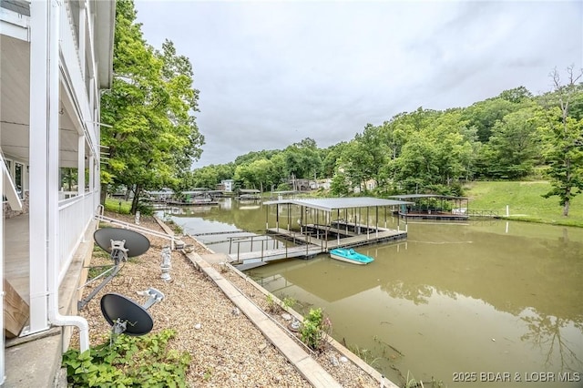 29 Vine St, Edwards, MO 65326 - dock area featuring a water view and a wooded view