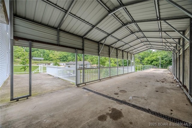 29 Vine St, Edwards, MO 65326 - view of parking featuring driveway and a carport